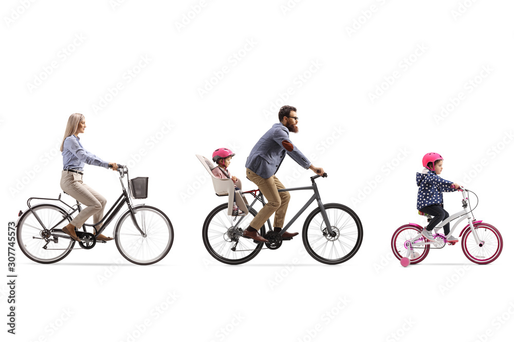 Active family of a mother, father with child in a seat and a little girl riding bicycles Active family of a mother, father with child in a seat and a little girl riding bicycles