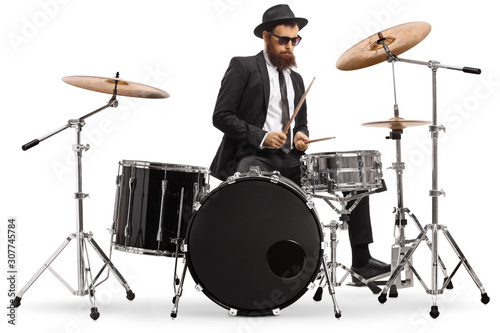 Elegant male drummer playing a drumkit