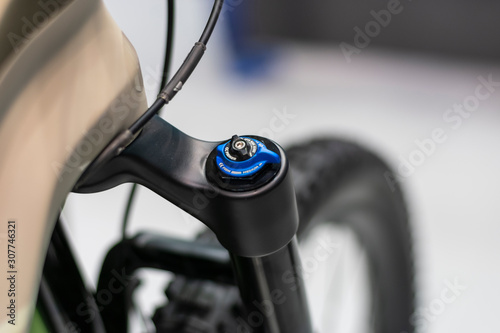 Bicycle suspension fork. Mountain bike suspension adjustment. © Yuri Hoyda