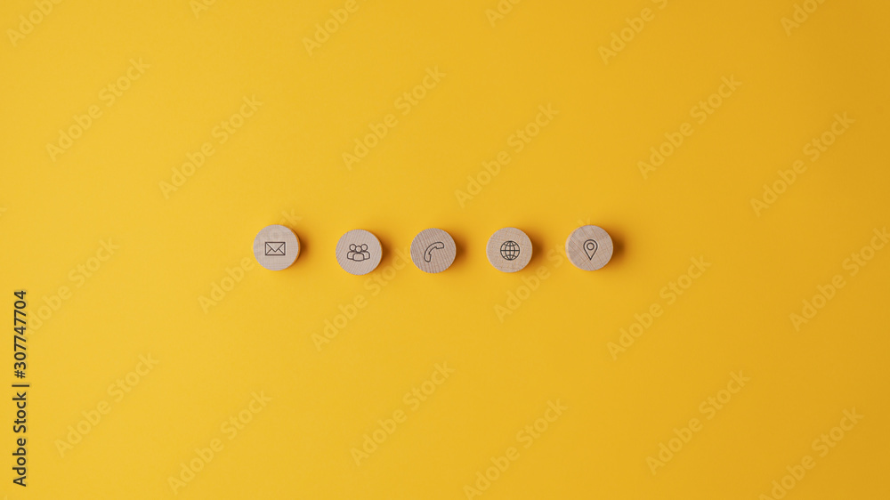Five wooden cut circles with contact and information icons Five wooden cut circles with contact and information icons
