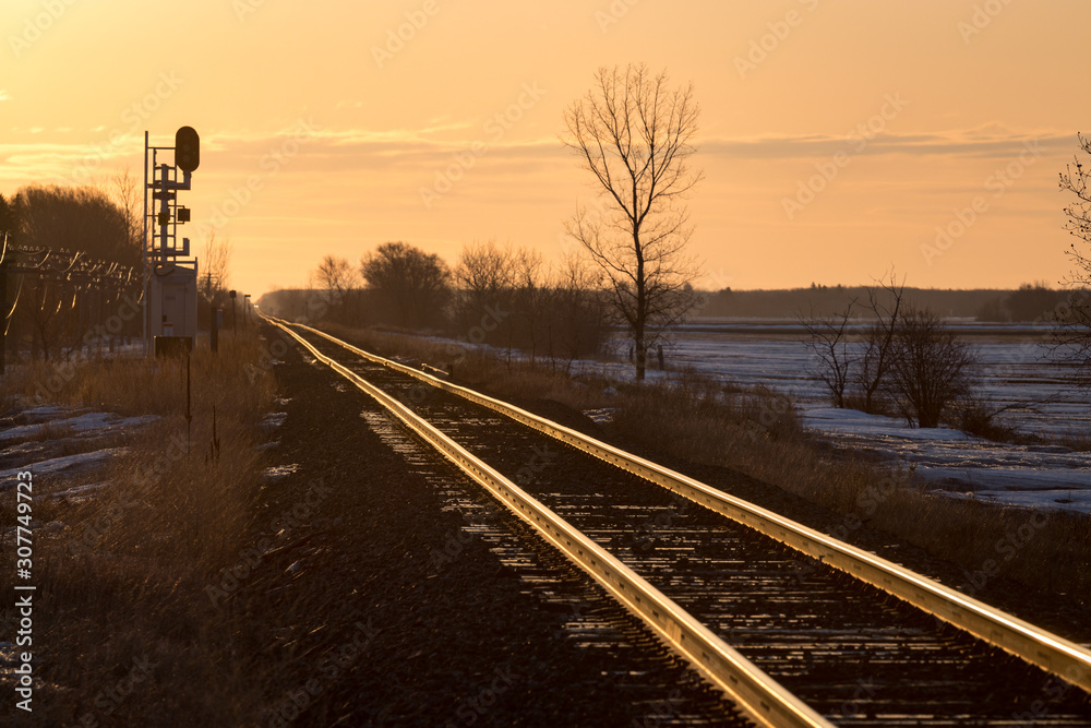 Golden Sunrise on Railway Tracks and Canadian Prairie Golden Sunrise on Railway Tracks and Canadian Prairie