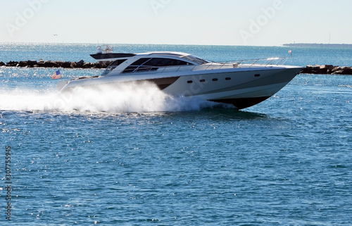 High-end cabin cruiser speeding through Government Cut off Miami Beach,Florida © Wimbledon