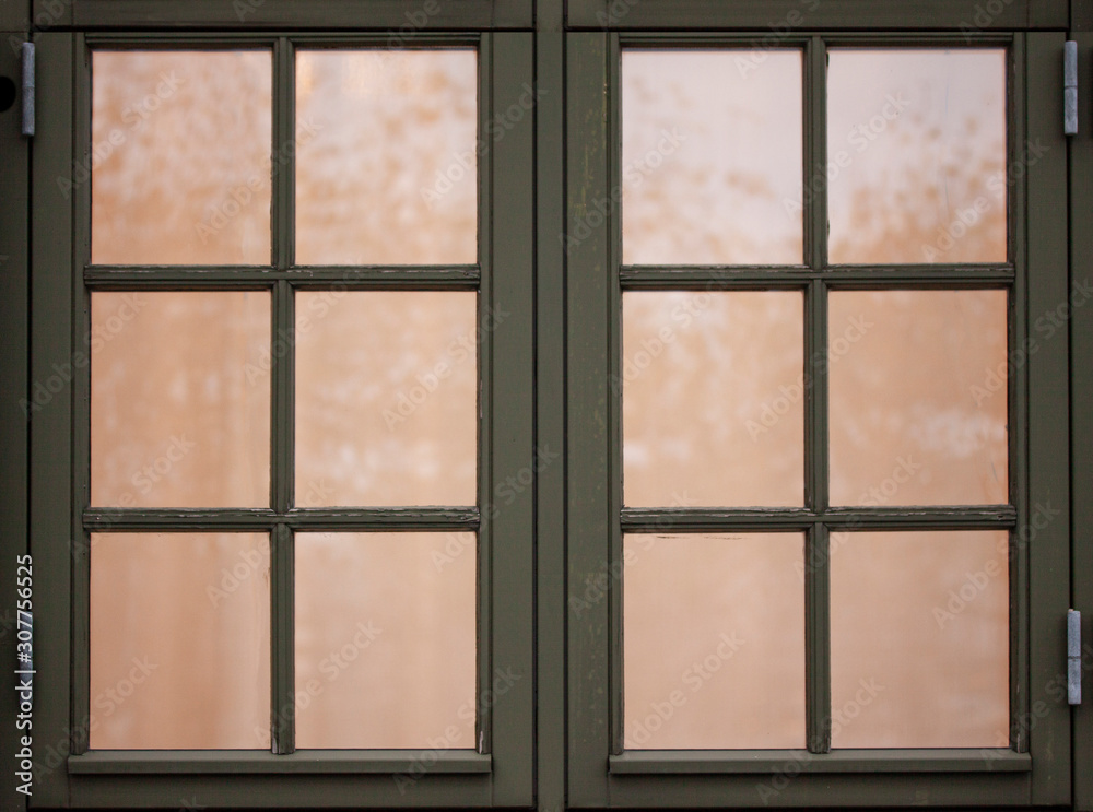 Fototapeta premium Old vintage wooden windows with 12 frames. Outside view and light inside. Close up image.