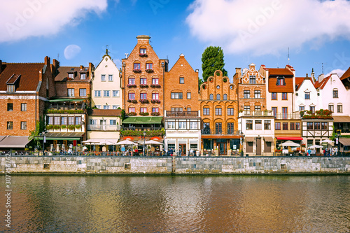 Scenic embankment of the Motlawa river with historical buildings in Gdansk, Poland