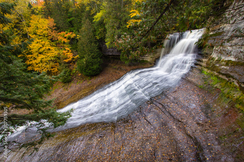Autumn Michigan Waterfall. Laughing Whitefish Falls Scenic Site surrounded by fall foliage in the Upper Peninsula of Michigan