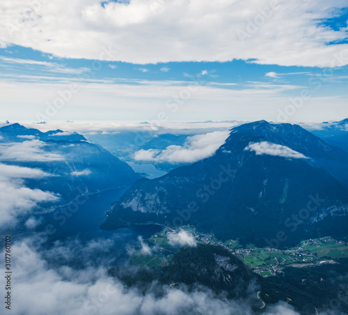 Panoramic summer view of Lake Hallstatt and surrounding mountains taken from viewing platform Five Fingers in Obertraun, Austria © sonatalitravel