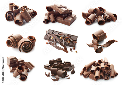 Pieces of chocolate with curls on white background