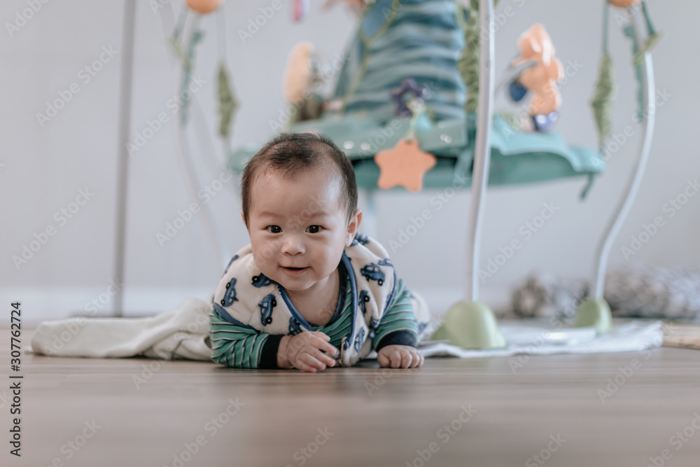 Asian baby boy doing tummy time at home Asian baby boy doing tummy time at home