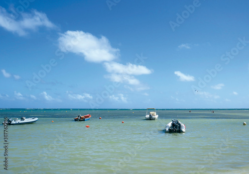  Small boats moored in the Caribbean Sea. Beach on the French island of Martinique. French West Indies. Antilles
