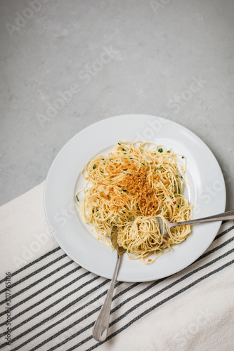 Vegan Spaghetti on Gray and White Cloth on Gray Countertop