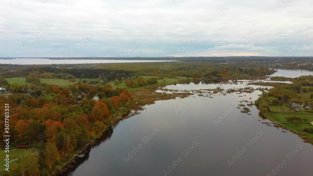 Fly Above Doles Sala, the Second Largest Island in Latvia. This is a Peninsula in the Daugava River, Near the Borders of Riga. Aerial Dron Shoot. Sunny Autumn Day. Fly Above Doles Sala, the Second Largest Island in Latvia. This is a Peninsula in the Daugava River, Near the Borders of Riga. Aerial Dron Shoot. Sunny Autumn Day.