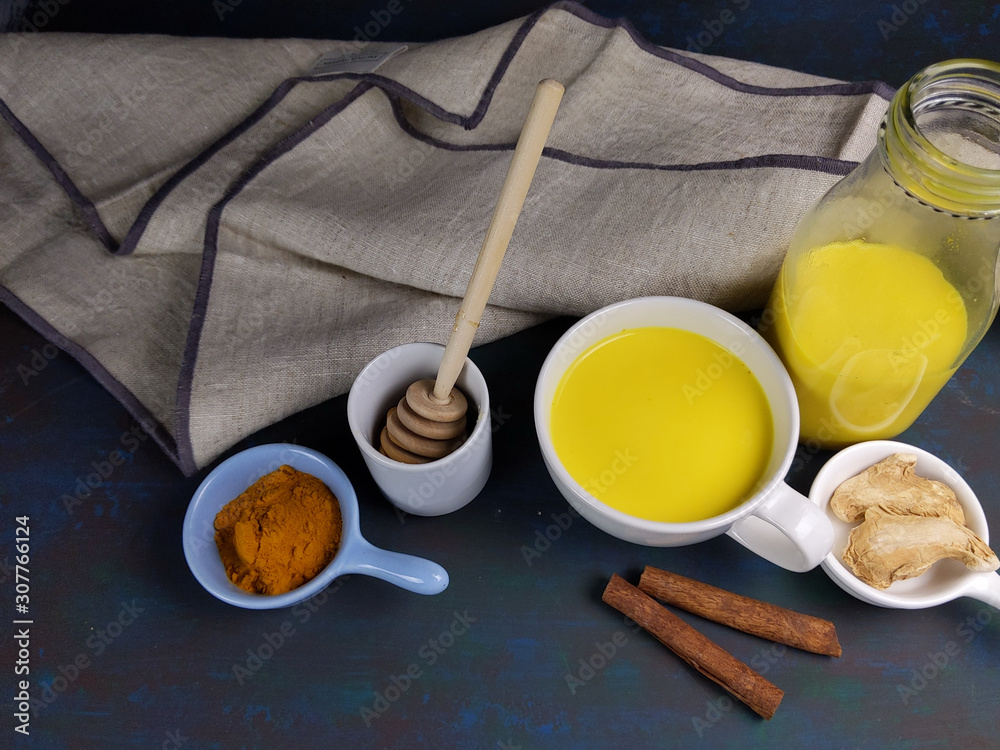 Turmeric latte or the Indian Haldi Doodh with superfood Turmeric powder, Ginder and Cinnamon sweetened with honey. Turmeric latte or the Indian Haldi Doodh with superfood Turmeric powder, Ginder and Cinnamon sweetened with honey.