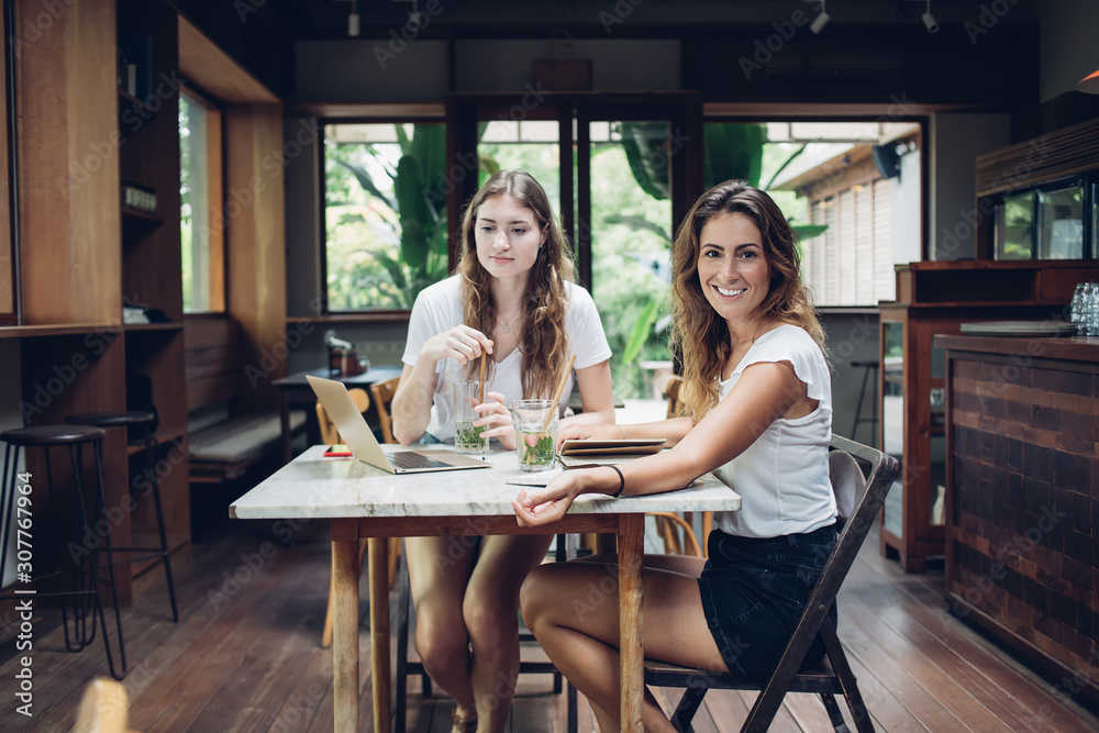 Relaxing casual women meeting in tropical bar Relaxing casual women meeting in tropical bar