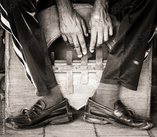 a Musical instrument, Mbira, being played in Cuba