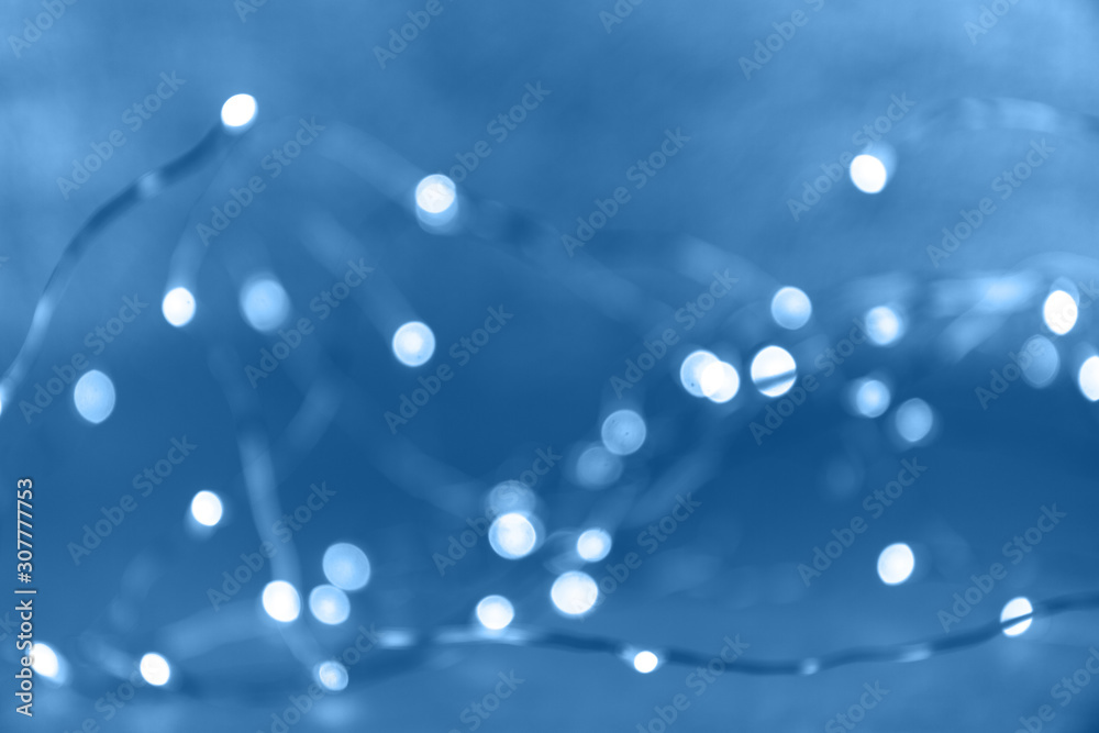 Classic blue background with bokeh lights. Holiday, Christmas and New Year background. Horizontal