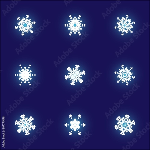 Set of christmas cut-out snowflakes on blue background.