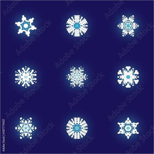 Collection of paper cut isolated snowflakes on blue background.
