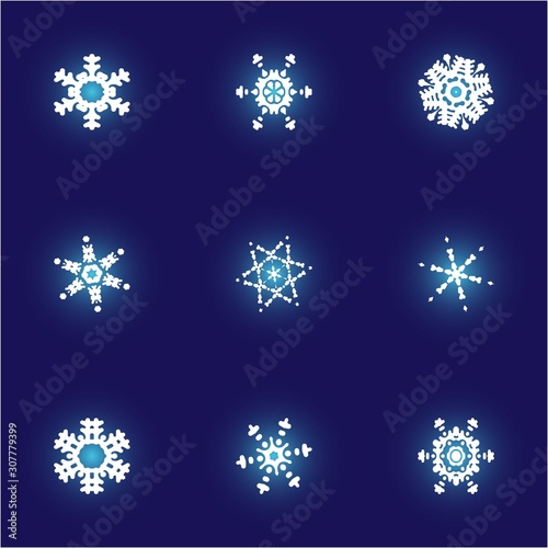 Set of christmas cut-out snowflakes on blue background.