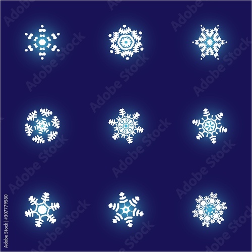 Collection of paper cut isolated snowflakes on blue background.