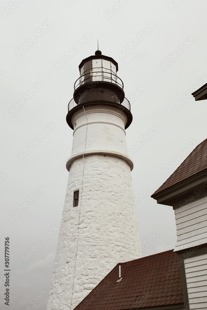 Portland Head Lighthouse Museum on a cold and stormy Fall day in Cape Elizabeth, Maine. Portland Head Lighthouse Museum on a cold and stormy Fall day in Cape Elizabeth, Maine.