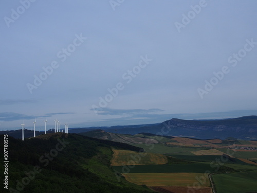 View of windmill on the road to Santiago de Compostela, El Camino de Santiago, Journey from Pamplona to Puenta la Reina, French way, Spain photo