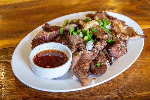 Grilled meat cow or beef call "Tiger Cry" of Thai food style for eating with Somtum.