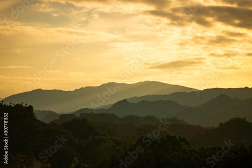Beautiful mountains and forests with fog.At sunset.