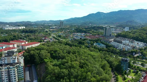 4K Aerial Drone Footage Of Beautiful Rural Town with local lifestyle houses at Menggatal Town, Sabah, Malaysia photo