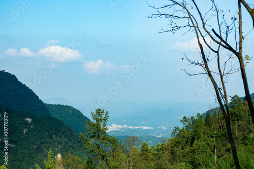 Steep mountains and forests under the sky