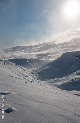 Strong wind in the mountains in winter in Kamchatka