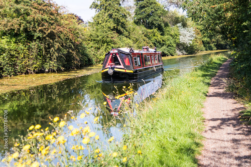 Print op canvas A narrowboat makes its way along the Grand Union canal