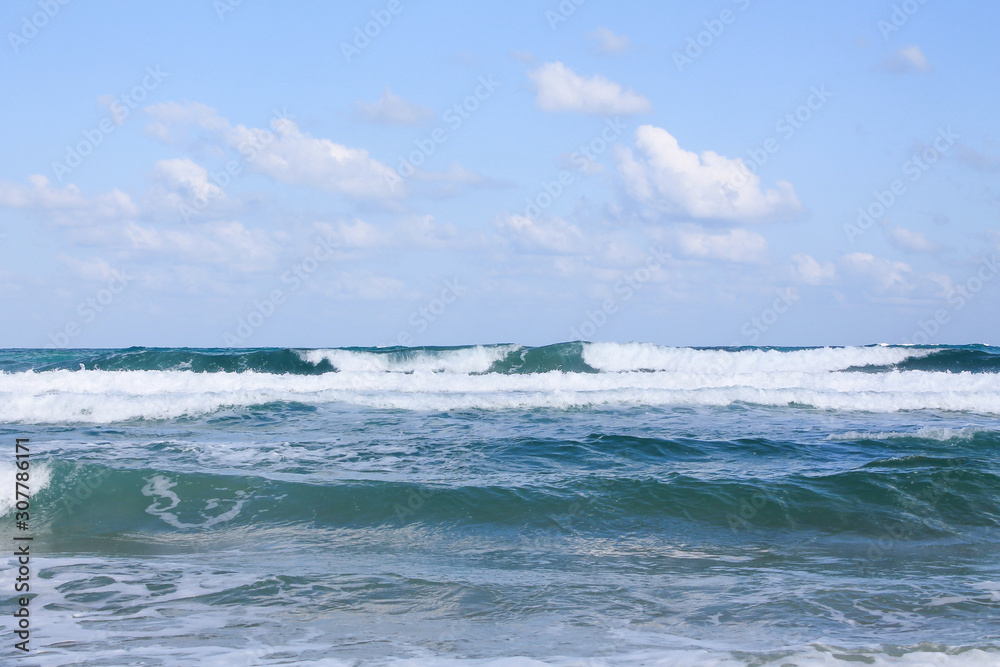 Seashore at Bat Yam, Israel. Waves on the blue stormy sea. Mediterranean coastline. Travelling picture. Turquoise water and sandy beach Seashore at Bat Yam, Israel. Waves on the blue stormy sea. Mediterranean coastline. Travelling picture. Turquoise water and sandy beach