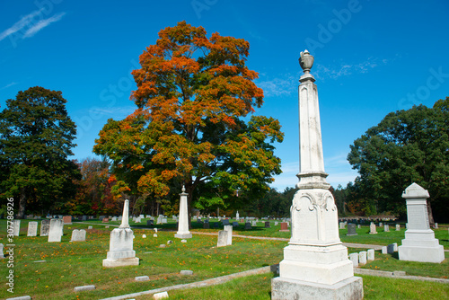 Last Rest Cemetery and trees with fall foliage in Merrimack, New Hampshire, NH, USA. photo