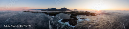 Ucluelet, Vancouver Island, British Columbia, Canada. Aerial Panoramic View of a Small Town near Tofino on a Rocky Pacific Ocean Coast during a cloudy  and colorful morning sunrise. © edb3_16