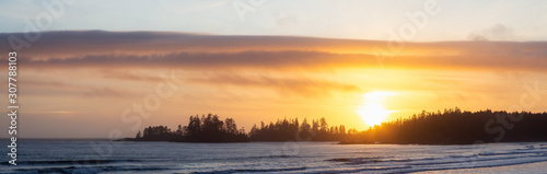 Long Beach  Near Tofino and Ucluelet in Vancouver Island  BC  Canada. Beautiful panoramic view of a sandy beach on the Pacific Ocean Coast during a vibrant sunset.