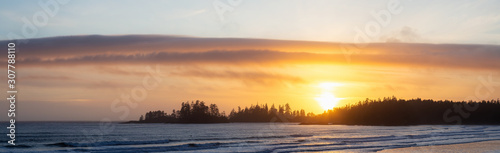 Long Beach  Near Tofino and Ucluelet in Vancouver Island  BC  Canada. Beautiful panoramic view of a sandy beach on the Pacific Ocean Coast during a vibrant sunset.