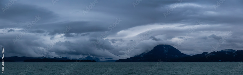 Beautiful Panoramic Landscape View during a dramatic and cloudy sunset. Taken in Howe Sound near Vancouver, BC, Canada.