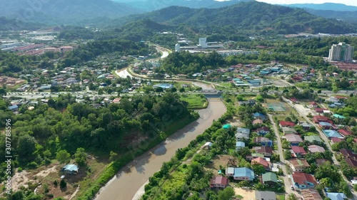 4K Aerial Drone Footage Of Beautiful Rural Town with local lifestyle houses at Menggatal Town, Sabah, Malaysia photo