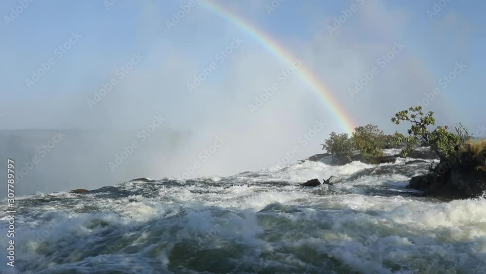 The powerful rapids in the Zambezi River right above Victoria Falls. Shot from the Zambia side of the river. The powerful rapids in the Zambezi River right above Victoria Falls. Shot from the Zambia side of the river.