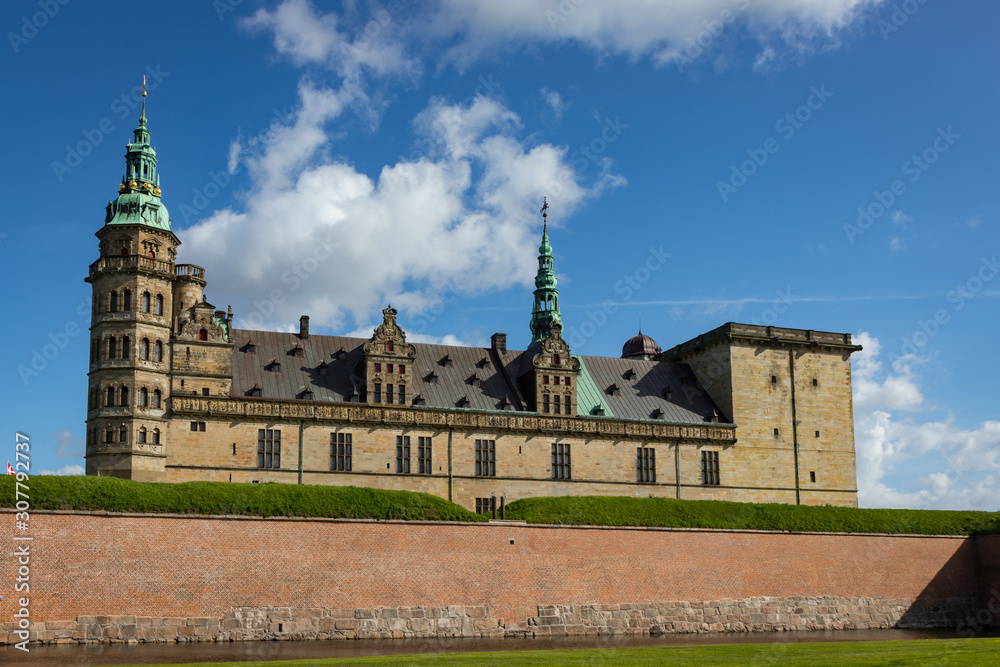 Scenic Kronborg Castle Looms Above Brick Wall and Moat Scenic Kronborg Castle Looms Above Brick Wall and Moat