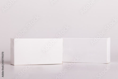 White pills box. Plastic bottles. Drugs box mock-up. Medical blank cardboard. Mockup. Pills bottle