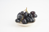 Fresh grape fruits plated over the white background