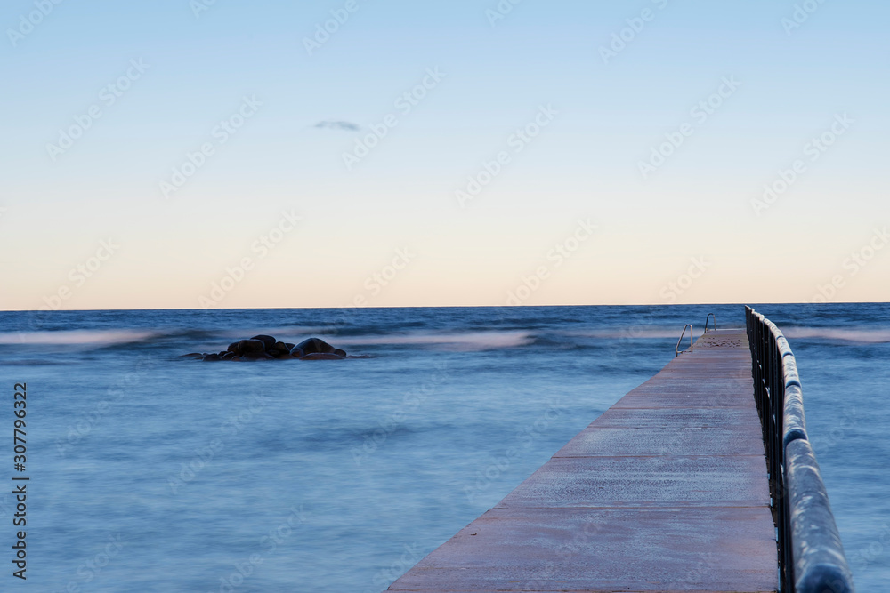 Obraz premium Bath pier during sunrise at island of Gotland, Sweden