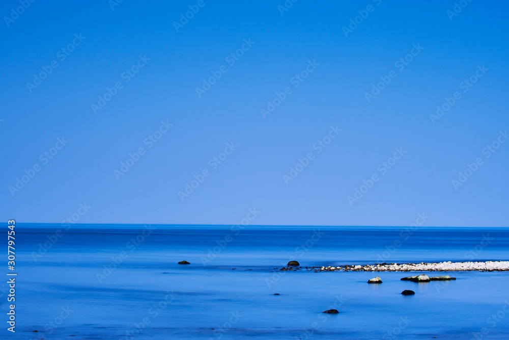 Coastal landscape under dark blue sky Coastal landscape under dark blue sky