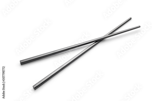 Metal black chopsticks on white background
