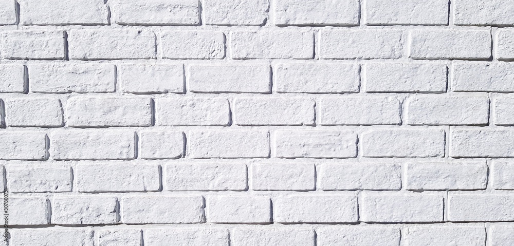Pattern white brick wall painted for background. Art wallpaper and Architecture Exterior design concept 