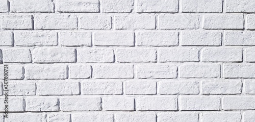 Pattern white brick wall painted for background. Art wallpaper and Architecture Exterior design concept 