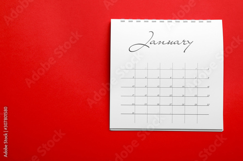 January calendar on red background, top view. Space for text