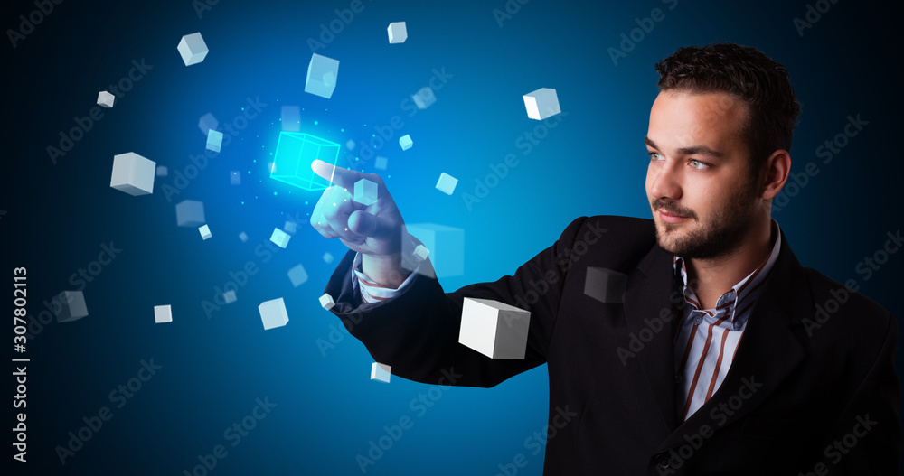 Man touching hologram screen displaying cube symbols Man touching hologram screen displaying cube symbols
