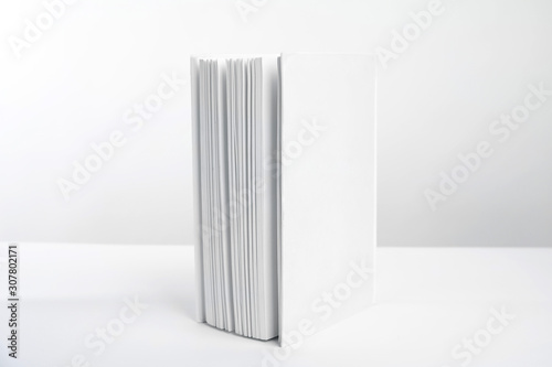 Book with blank cover on white background